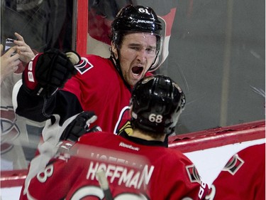 A fan cheers as Mark Stone celebrates his goal during third period NHL action against the Montreal Canadiens Wednesday February 18, 2015 in Ottawa. The Senators defeated the Canadiens 4-2.