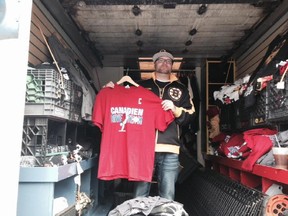 Matt Waugh of ilovebostonsports.com holds up one of the T-shirts he was selling in Boston before Game 1 of the Canadiens-Bruins playoff series on May 1, 2014.