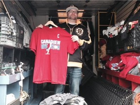 Matt Waugh of ilovebostonsports.com holds up one of the T-shirts he was selling in Boston before Game 1 of the Canadiens-Bruins playoff series on May 1, 2014.