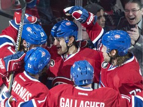 The Canadiens' Max Pacioretty (centre) celebrates with teammates after scoring against the Columbus Blue Jackets during first period of game at the Bell Centre on Feb. 21, 2015.