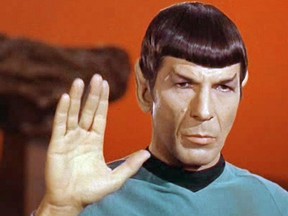 Leonard Nimoy, as Spock in the original Star Trek television series, gives the 'live long and prosper' hand salute.