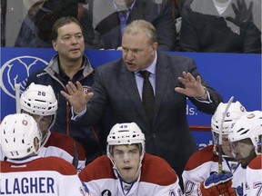 Canadiens head coach Michel Therrien talks to his team during the third period of game against the Red Wings on Feb. 16, 2015, in Detroit. The Canadiens won 2-0.