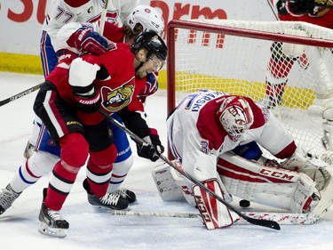 Ottawa Senators left wing Milan Michalek puts the puck past Montreal Canadiens goalie Dustin Tokarski under pressure from defenceman Nathan Beaulieu during second period NHL action Wednesday, February 18, 2015 in Ottawa.