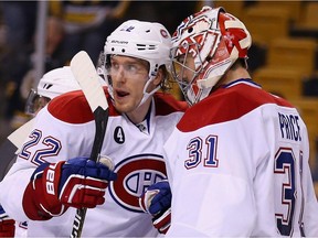 Dale Weise congratulates Carey Price of the Montreal Canadiens after the game against the Boston Bruins at TD Garden on February 8, 2015 in Boston, Mass.