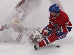Canadiens forward Gabriel Dumont slides into Arizona Coyotes goalie Louis Domingue  during third period action at the Bell Centre on  Feb. 1, 2015.