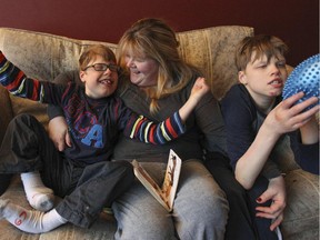 MONTREAL, QUE.: February 09, 2015 -- Ann Gagnon with her boys Kieran, left, and Bradley at their home in Saint-Lazare, west of Montreal Monday February 09, 2015.  With two severely handicapped children Gagnon feels underserved by her local CLSC.  (John Mahoney / MONTREAL GAZETTE)