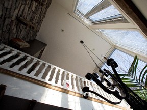 A wall of glass extends two storeys high in the home of Alain Dancyger, not seen, in Montreal on Tuesday February 10, 2015. The sunroom was an addition added by Dancyger and his partner.