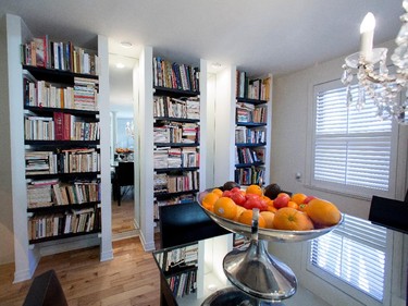 Bookcases line the dining room wall.