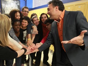 Comedian Joe Cacchione, right, also vice-prinipal at the Galileo Adult Centre in the Montreal North area of Montreal, has some fun with students and facilitator Lu Termini, rear left, on Wednesday, Feb. 11, 2015.