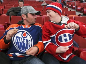 Montreal Canadiens fan Liz Gomes faces off with her Edmonton Oilers fan/husband Bryan prior to National Hockey League game in Montreal Thursday February 12, 2015.  The Edmonton residents were in Montreal to see two Habs games.