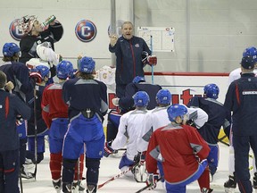 Canadiens coach Michel Therrien speaks to his players during practice at the Bell Sports Complex in Brossard on Feb. 13, 2015.