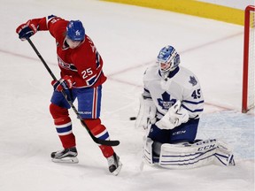 The Canadiens' Jacob De La Rose tries to deflect a shot past  Toronto Maple Leafs goalie Jonathan Bernier during game at the Bell Centre on Feb. 14, 2015. The Canadiens won 2-1 in a shootout.