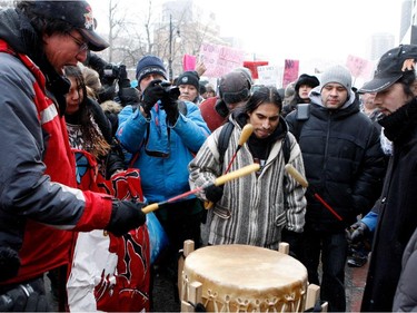 Native drummers perform as protestors take part in the Memorial March for Missing and Murdered Women in Montreal on Saturday, February 14, 2015.