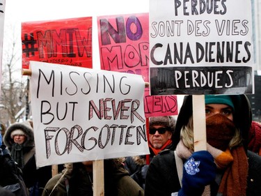 Protesters take part in the Memorial March for Missing and Murdered Women in Montreal on Saturday, February 14, 2015.