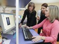 Dr. Hope Weiler, left, principal investigator and associate professor; May Slim, registered dietician and PHD candidate; and Catherine Vanstone, registered nurse and clinical research associate; look at a  bone density scan at the Mary Emily Clinical Nutrician Research Unit at the Macdonald Campus of McGill University in Ste-Anne-de-Bellevue on Monday February 16, 2015.  The three are involved in a study on the affect of dairy products on bone density.