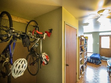 Bicycles hanging near the main entrance at the home of couple Jax Jacobsen and Matt Coté in the Plateau.