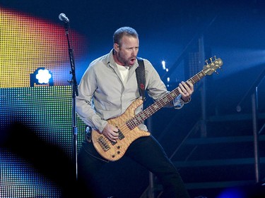 Bass guitarist Mike Kroeger of Nickelback performs on stage at the Bell Centre on February 18, 2015 in Montreal.