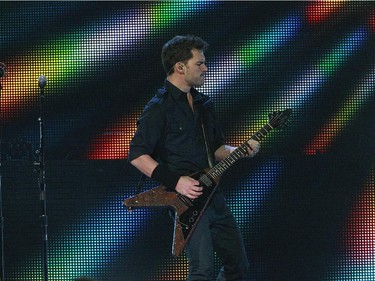 Guitarist Ryan Peake of Nickelback performs on stage at the Bell Centre on February 18, 2015 in Montreal.