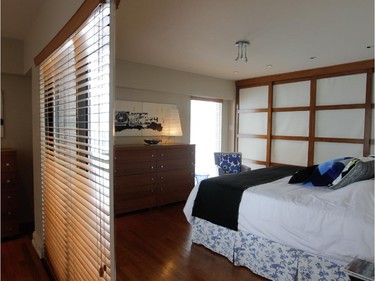 A miror-reflected view of the master bedroom.