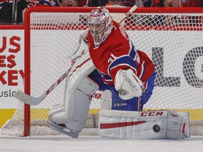 Canadiens goalie Carey Price tosses the puck away after making save during shootout against the Florida Panthers at the Bell Centre on Feb. 19, 2015. The Panthers won 3-2.