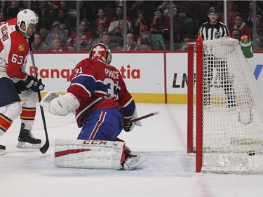Montreal Canadiens goalie Carey Price and Florida Panthers Dave Bolland watch Panthers Tomas Fleischmann's shot reach the back of the net during second period of National Hockey League game in Montreal Thursday February 19, 2015.