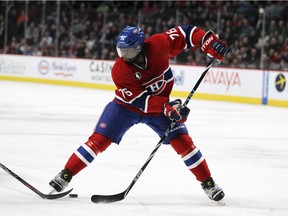 Canadiens P.K Subban passes the puck backwards through his legs during first period of National Hockey League game against the Florida Panthers in Montreal on Feb. 19, 2015.
