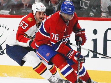 Montreal Canadiens P.K. Subban controls the puck despite pressure from Florida Panthers Dave Bolland during National Hockey League game in Montreal Thursday February 19, 2015.