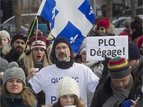 Protesters take part in protest against provincial government austerity measures and the privatization of public services, at Parc Emilie Gamelin in Montreal on  Sunday, Feb. 22, 2015.
