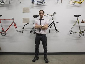Benjamin Adler with refurbished bike frames at Rebicycle in Mile End.
