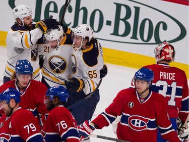 Buffalo Sabres defenceman Mike Weber, left to right,  Buffalo Sabres right wing Drew Stafford, Buffalo Sabres right wing Brian Flynn celebrate scoring against the Montreal Canadiens during NHL action at the Bell Centre in Montreal on Tuesday February 3, 2015.
