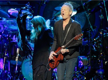 Guitarist/ singer Lindsey Buckingham of the band Fleetwood Mac plays in front of singer Stevie Nicks during the band's show at the Bell Centre in Montreal on Thursday, February 5, 2015.