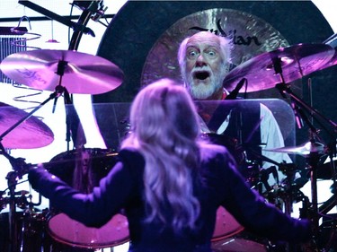 Mick Fleetwood, drummer for the band Fleetwood Mac, looks out at singer Stevie Nicks from behind his well-equipped kit during the band's show at the Bell Centre in Montreal on Thursday, February 5, 2015.