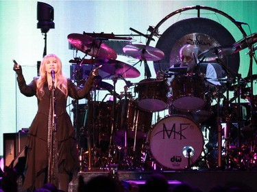 Singer Stevie Nicks looks out at the audience during the performance of the band Fleetwood Mac at the Bell Centre in Montreal on Thursday, February 5, 2015. On the right is Mick Fleetwood, original drummer for the band.