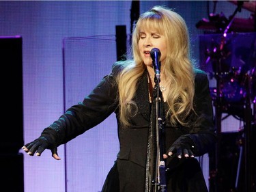 Singer Stevie Nicks of the band Fleetwood Mac plays 'air keyboard' during the band's show at the Bell Centre in Montreal on Thursday, February 5, 2015.