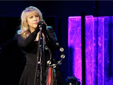 Singer Stevie Nicks of the band Fleetwood Mac, tambourine at the ready, during the band's show at the Bell Centre in Montreal on Thursday, February 5, 2015.