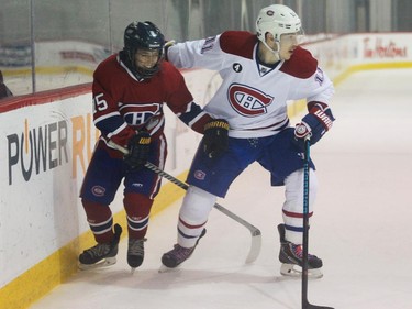 Brendan Gallagher of the Montreal Canadiens holds up Samuel Pilon of the AAA pee wee team called Conquérants des Basses-Laurentides during a scrimmage at Bell Sports Complex in Brossard in Montreal, on Friday, February 6, 2015.