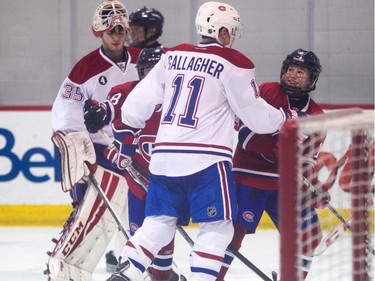 William Lavigne of the AAA pee wee team called Conquérants des Basses-Laurentides looks up to Brendan Gallagher who was approaching him in a 'threatening' manner during a scrimmage at Bell Sports Complex in Brossard in Montreal, on Friday, February 6, 2015. The team will be representing the Canadiens at the upcoming Quebec City pee wee tournament.