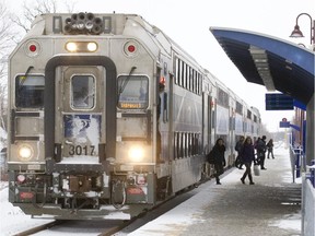 Commuters disembark from an AMT train at the Vaudreuil Train station in Vaudreuil-Dorion.