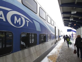 Passengers prepare to board an AMT train at the Vaudreuil train station.