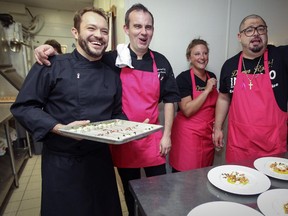 Olivier Perret, executive chef at Renoir, second from left, enjoys a light moment with fellow chefs Stéphan Rémon of Mon Traiteur, left, and Ashley Thornton and Nick DePalma of Inferno, during a fundraiser dinner.