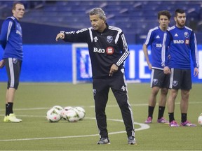 Impact coach Frank Klopas instructs players during the first day of training camp at Montreal's Olympic Stadium on Jan. 23, 2015.