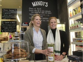 Owners Rebecca, left, and her sister Mandy Wolfe are all smiles as they stand behind the counter at Mandy's in Westmount.