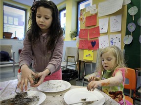Corinne Sevigny, left, and Jilly Juhl, make bird nests while doing arts and crafts at the Unitarian Church in Montreal.