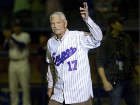 Former Expos manager Felipe Alou waves to the crowd as he takes part in a ceremony to honour the team before an exhibition game between the Toronto Blue Jays and New York Mets at Montreal's Olympic Stadium on March 29, 2014.