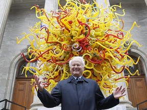 Sebastian van Berkom stands in front of The Sun, a glass sculpture by Dale Chihuly on Wednesday. The Montreal Museum of Fine Arts will get to keep The Sun, thanks to a big donation from Sebastian van Berkom.