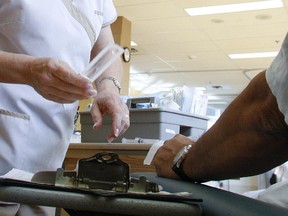 A nurse cares for a patient at the Ambulatory Care Centre at Maisonneuve Rosemont in Montreal in 2009.