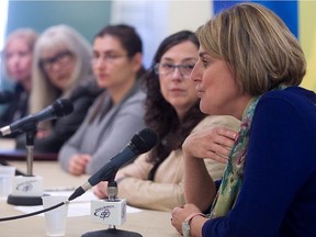 Cancer patient Josée Arsenault, right, speaks at press conference on Monday Oct. 6, 2014. A coalition is demanding that the provincial government review its policy on cancer drug approval for patients.