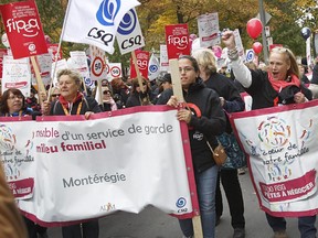 More than 13,000 home daycare workers on strike held two demonstrations in October 2014.