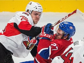 Ottawa Senators defenceman Mark Borowiecki checks Canadiens forward Alex Galchenyuk during preseason game at the Bell Centre in Montreal on Oct. 4, 2014.