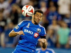 The Impact's Dilly Duka heads the ball during MLS game against the Los Angeles Galaxy at Saputo Stadium on  Sept. 10, 2014.